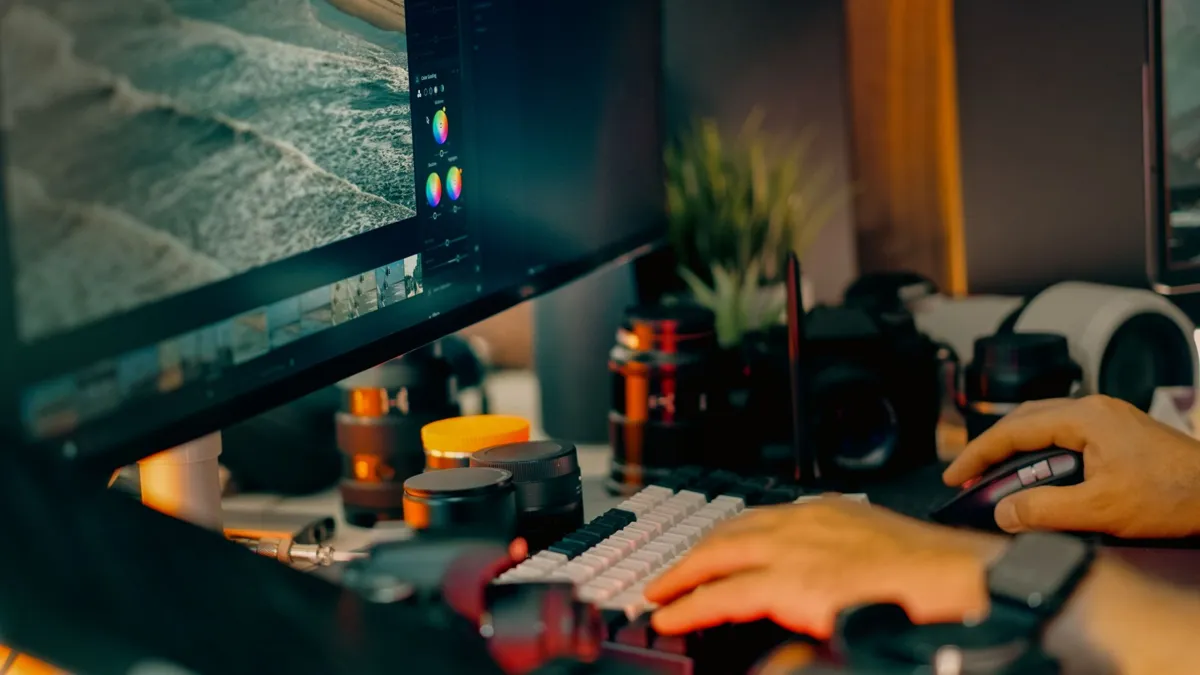 Photographer editing a seascape photo on a monitor