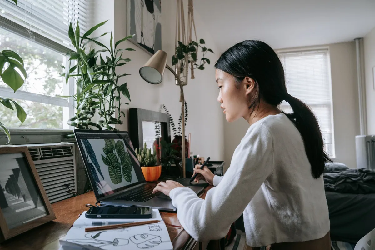 Designer working on a layout on a laptop