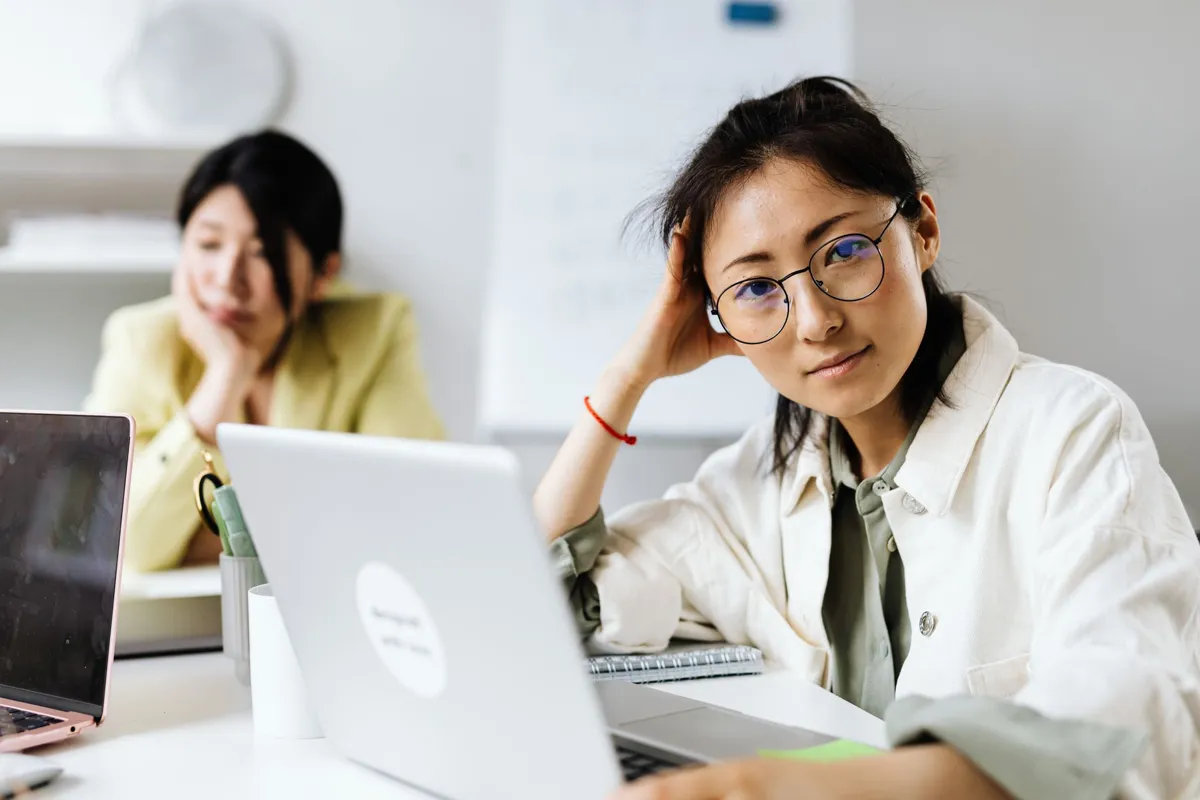Woman working on a laptop in an office
