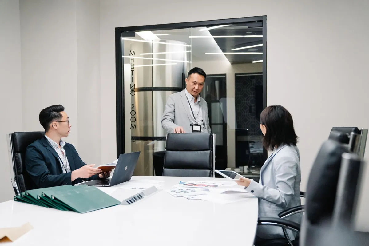Colleagues in a meeting room discussion