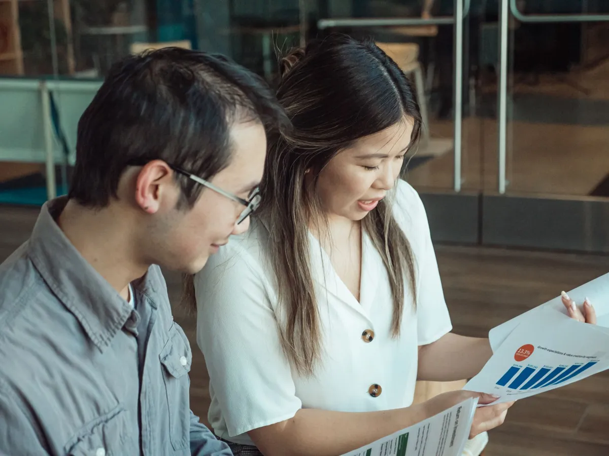 Colleagues reviewing a data dashboard together